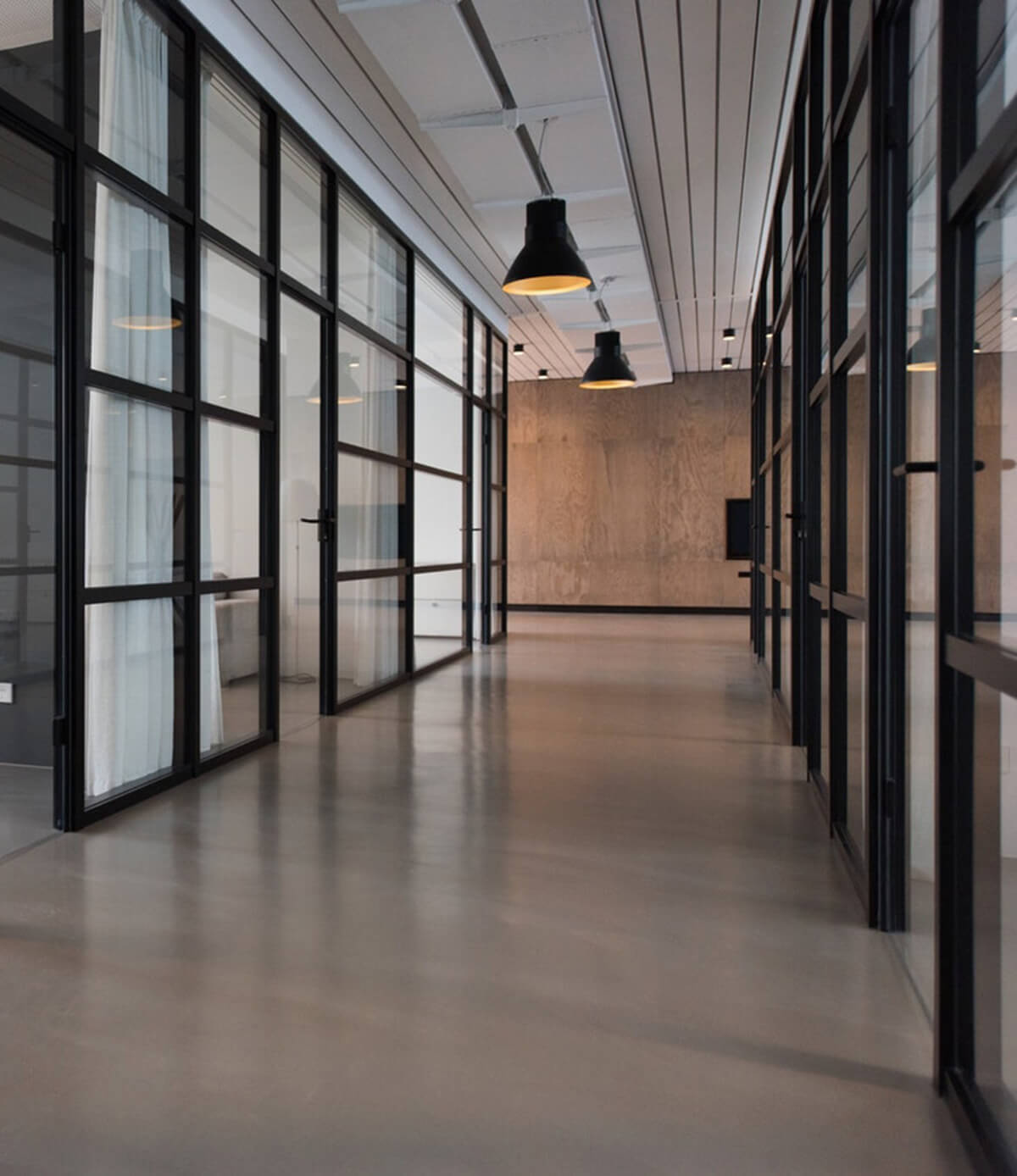 Image of an empty hallway in a modern office building.